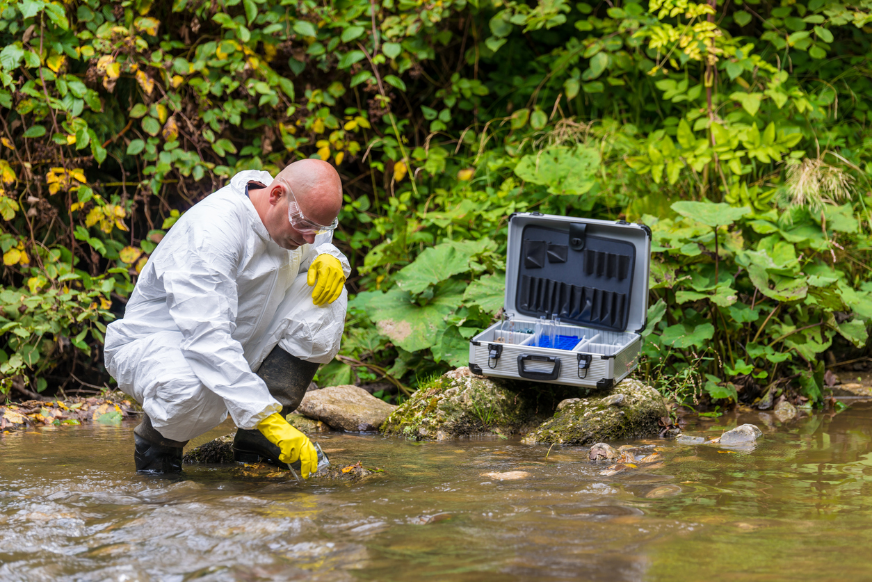 Scientist examing toxic water