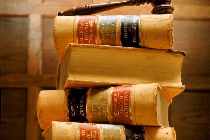 Stacked law books and gavel